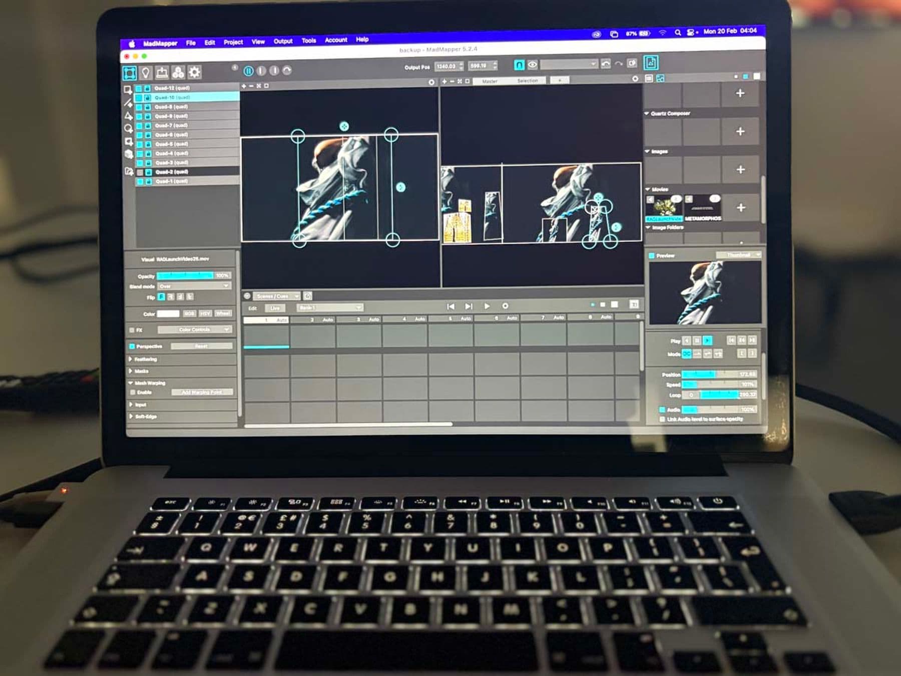 A photograph of a laptop screen displaying video editing software with multiple editing panels and controls.