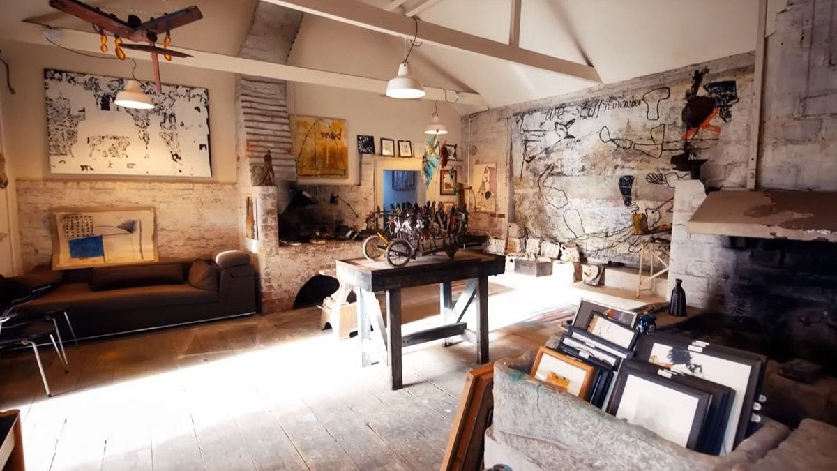 A photograph of the Blacksmith Shop Gallery in York in the old mill displaying Alan Gummerson's artwork in the form of sculptures, life drawings and assemblages.